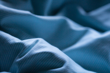 Night blue comfortable sheet on the sleep bed