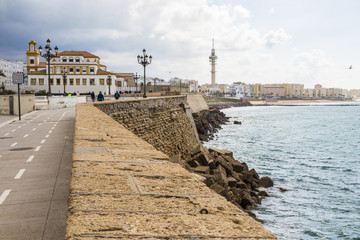 Seafront at Cadiz, Andalusia, Spain, with the bike path, the CEIP Campo del Sur public school and the Torre Tavira II telecommunications tower