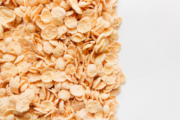 pile of delicious crispy cornflakes, food background,  healthy breakfast