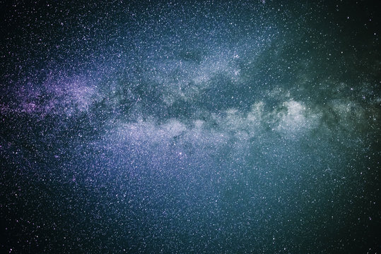 Background of starry purple and blue night sky with the Milky Way