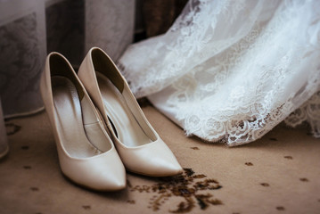 shoes near a wedding dress