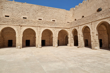 Medieval courtyard with arches in the fortress