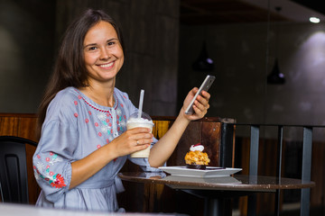Young woman have fun in cafe at breakfast