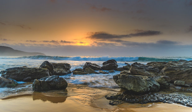 Hazy Sunrise Seascape with Rocks