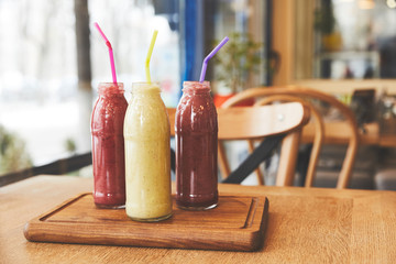 Healthy meal with fruit smoothies on table