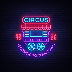 Circus truck logo in neon style. Design template with trailers. Neon sign, light banner, design element, bright night advertising for your projects. Sitting on wheels. Vector illustration