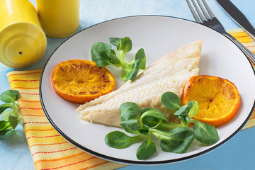 Flounder baked with tangerines