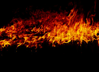 Fototapeta na wymiar Fire flames on a black
