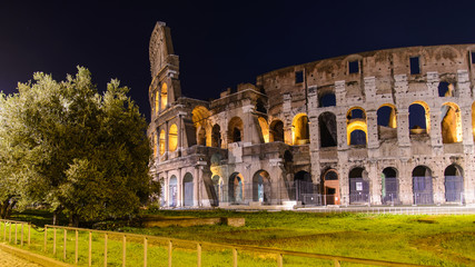 Monuments of ancient Rome at night. Colosseum, Arch of Constantine and Roman Forum