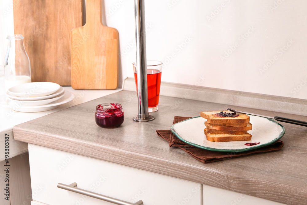 Sticker Plate with toasted bread and jam on table