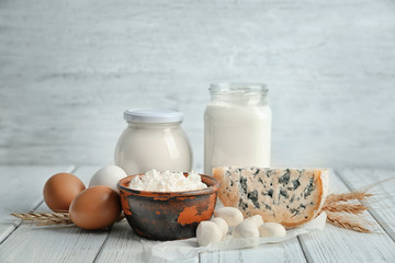 Different dairy products and eggs on table