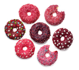 Delicious colorful donuts on white background