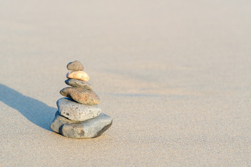 Fototapeta na wymiar Zen stone little pile on sea beach
