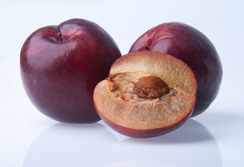 Plum. Ripe plum fruit on background