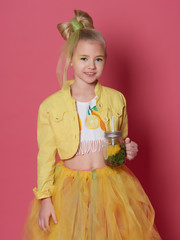 Little girl in suit of yellow lemon.