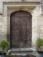 Ancient studded wood entrance door