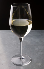 Glass of white wine on a bar counter