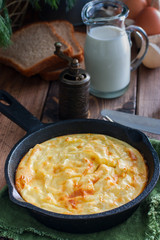 Potato casserole in a portioned cast-iron frying pan, selective focus