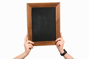 Cropped view of woman hands holding empty blackboard isolated on white
