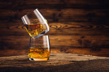 Whiskey glass on the old wooden table