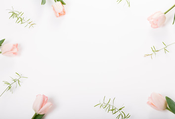 Flowers composition. Frame made of pink flowers on white background. Valentine's Day. Flat lay, top view.