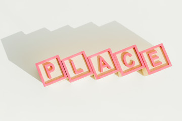 Top view of word place on letter wooden blocks