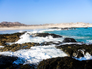 Water waves on the rocky beach