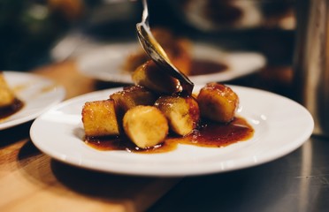 Fried bananas dessert with caramel sauce.