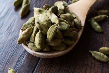 Cardamom Seeds in Wooden Spoon.