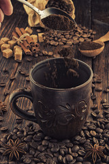 clay cup with coffee on the background of grains