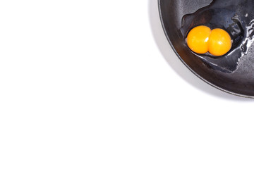 White background with egg in a frying pan