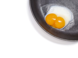 White background with egg in a frying pan