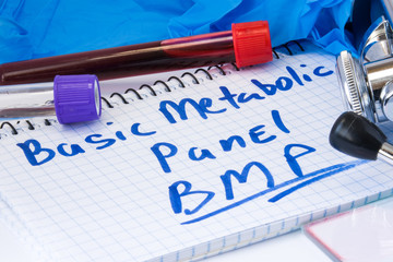 Basic metabolic panel (BMP) biochemical blood test concept photo. Note with text basic metabolic...