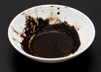 A cup of coffee on a black background