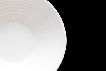 White plate for food on a black background