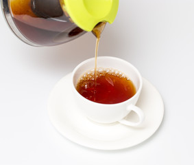 Tea in a cup on a white background