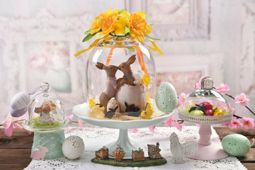 Easter decoration under glass dome on the table