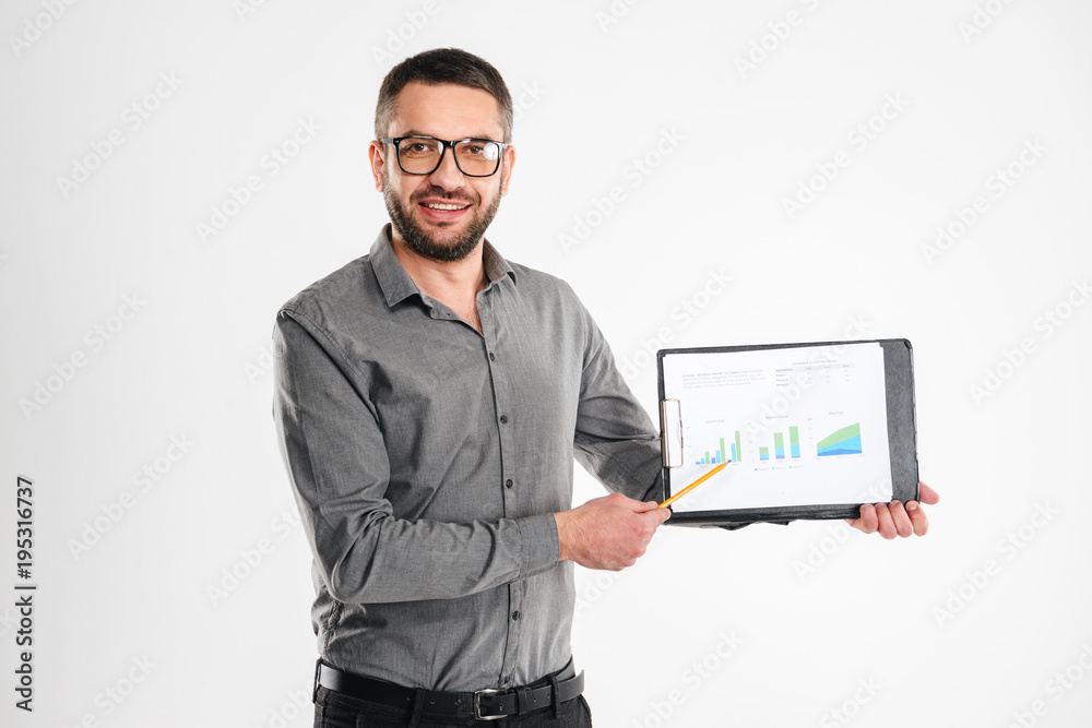 Canvas Prints Handsome businessman showing clipboard.