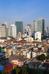 Fototapeta na wymiar Contrast between new and holding buildings in Bangkok, Thailand skyline