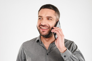 Handsome businessman talking by mobile phone.