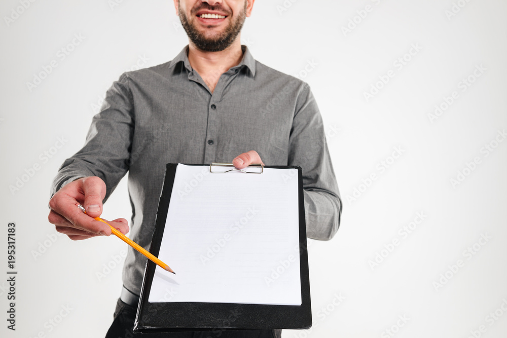 Canvas Prints Cropped photo of businessman showing clipboard.