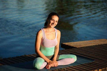 Fototapeta na wymiar Healthy woman lifestyle balanced practicing meditate and energy yoga on the bridge in morning the nature. Healthy Concept.