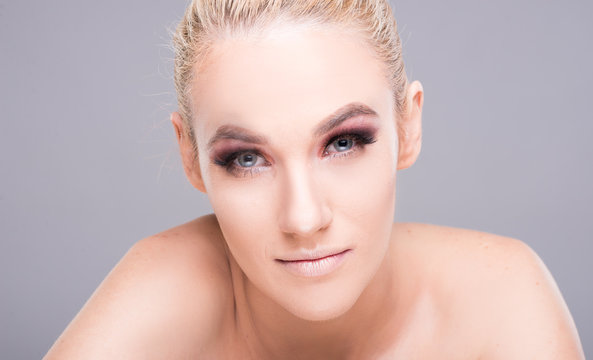 Attractive young model posing wearing professional make-up.