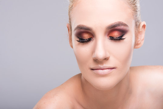 Attractive young model posing wearing glam make-up.