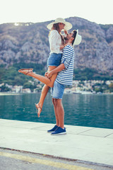 Couple in love, enjoying the summer time by the sea.