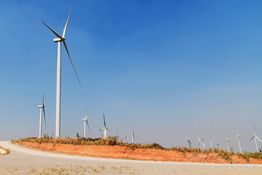 concept idea eco power energy. wind turbine on hill at thailand