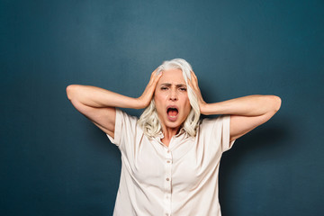 Mature old woman with headache