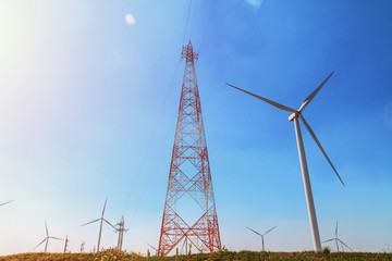 concept idea eco power energy. wind turbine on hill with sunset