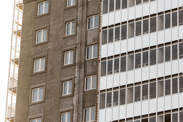Windows in a multi-storey building under construction as a background