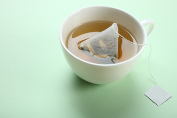 Mint tea bag in a cup